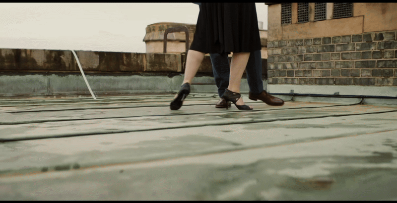 Professor T and Christina dance along the rooftop, this is shown to be imaginative