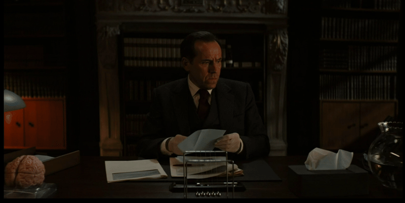 Professor T receives a fish from Diana